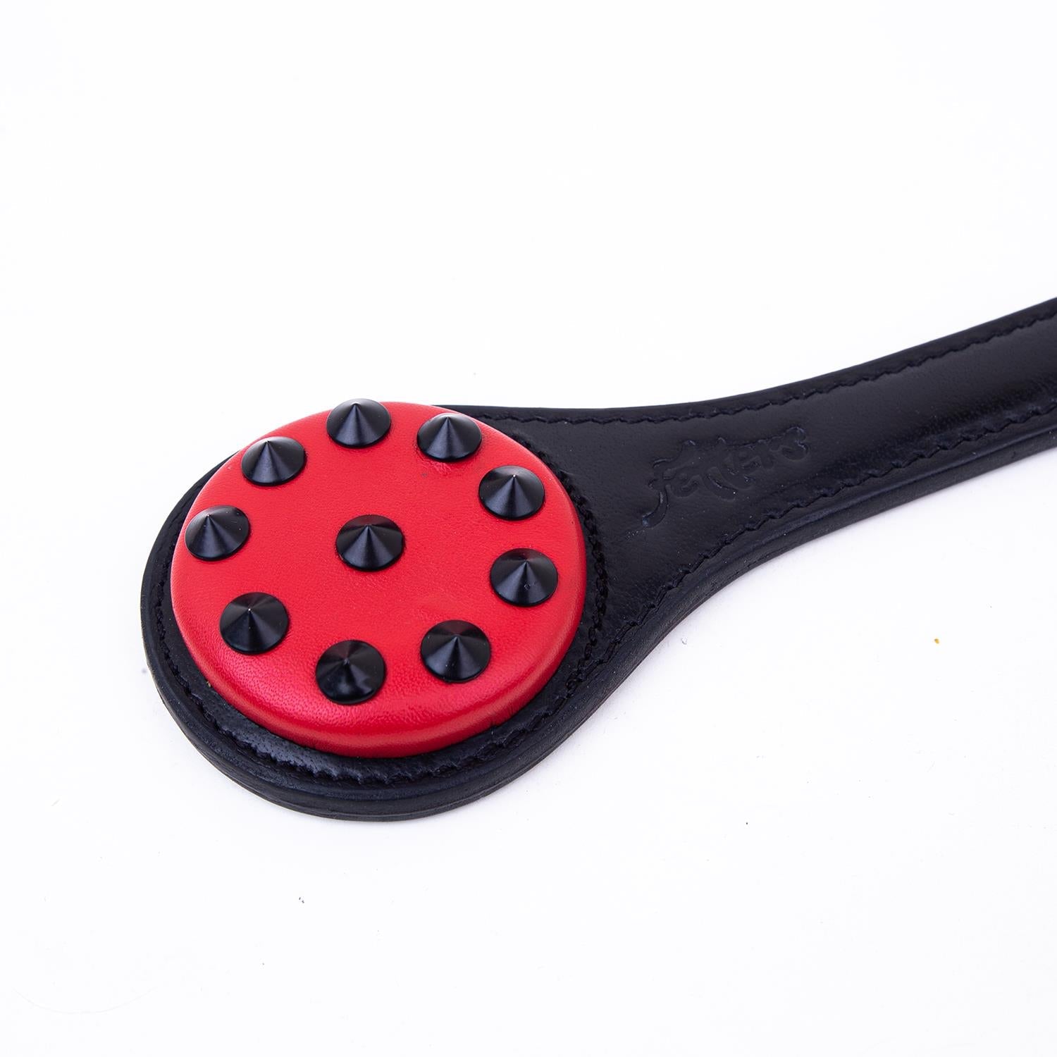 The Claw - Studded Ballbuster Paddle, Black & Red from Fetters.